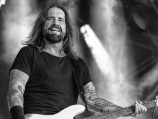  Man playing guitar at concert